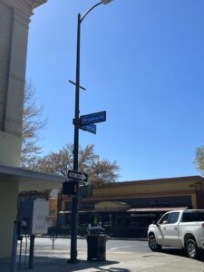 Photo of 1st And Broadway St. Signs, where you will find Thursday Night Market from April to September 2024